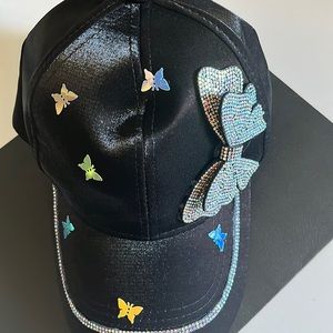Hat with butterfly accessory